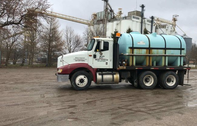 BP Dust Control truck servicing parking lot