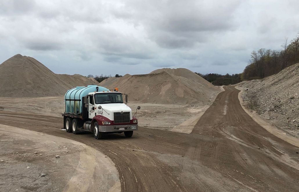 BP Dust Control truck servicing dirt road