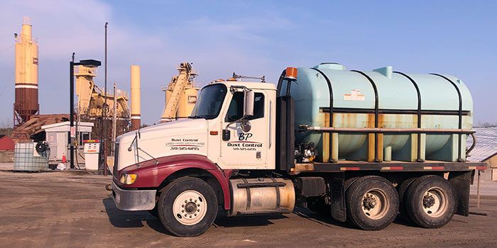 BP Dust Control truck spreading dust suppression at local grain elevator.